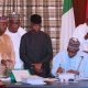 PRESIDENT BUHARI SIGNS